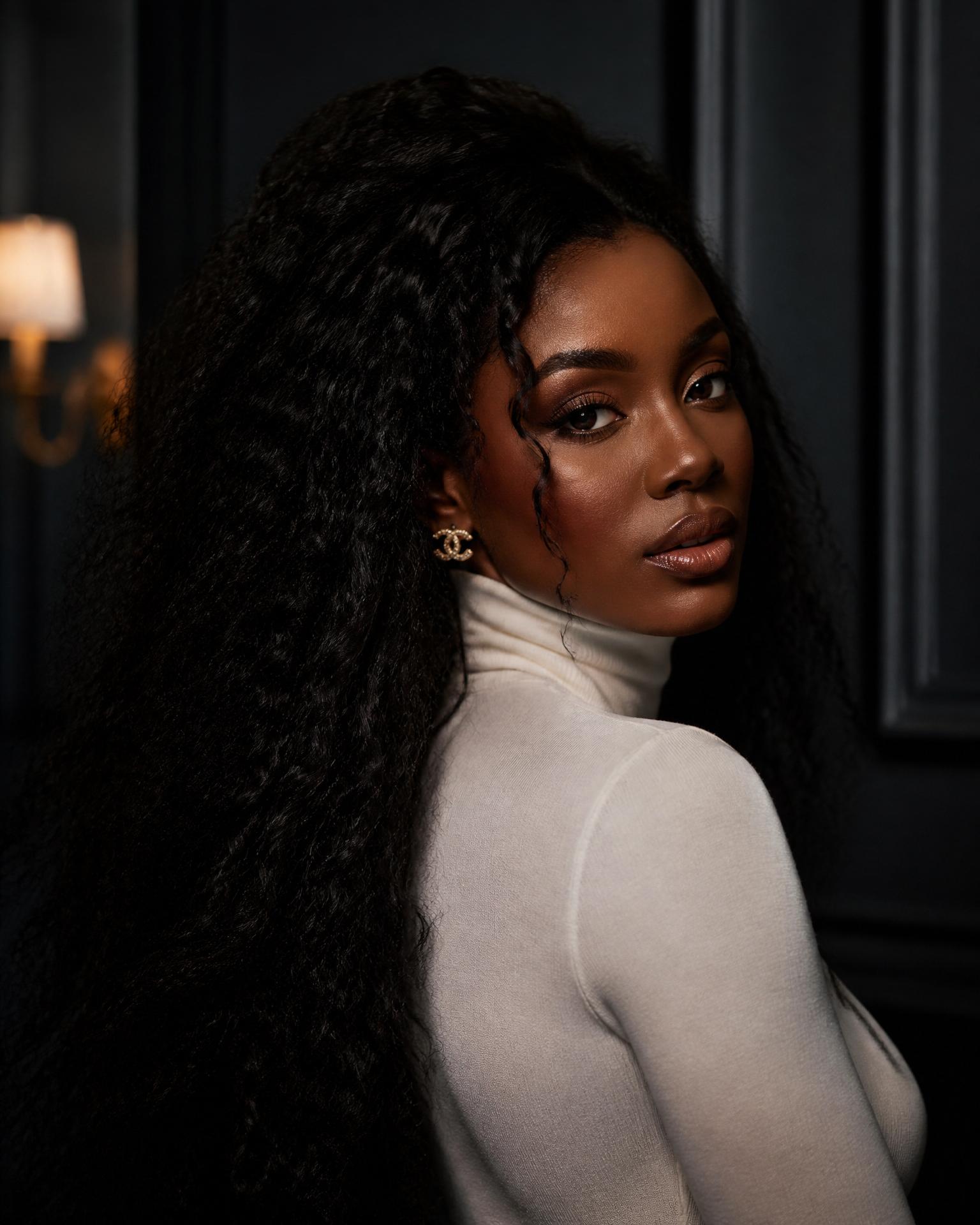 Barbadian woman with long, luxurious curly hair extensions